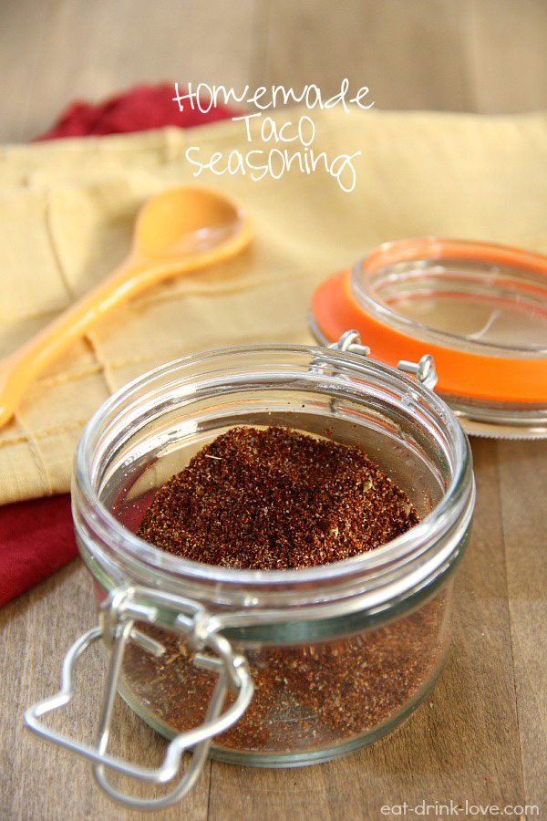 Homemade Taco Seasoning in a clear glass jar with a yellow napkin
