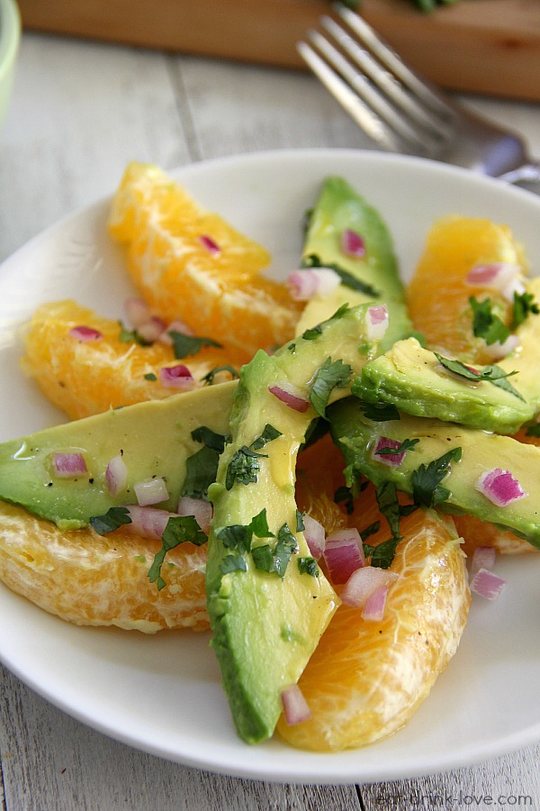 Close-up shot of Citrus Avocado Salad on a white plate