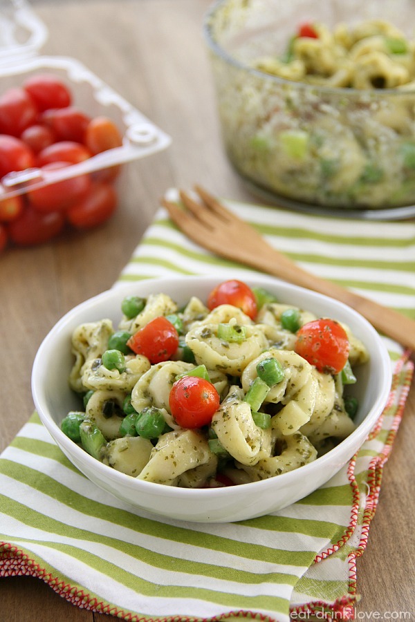 Pesto Tortellini Salad in a bowl with cherry tomatoes