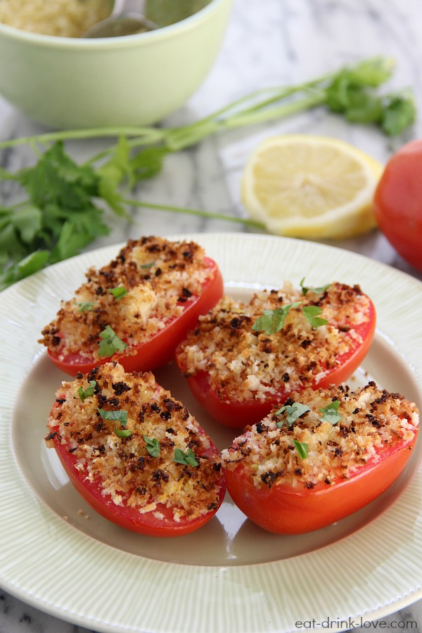 Toasty Tomatoes topped with breadcrumbs on a plate