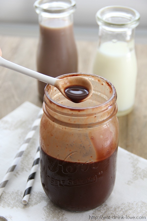 Homemade Chocolate Syrup in a jar with spoon