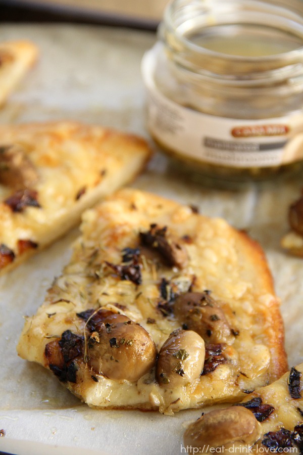 Mushroom and Gruyère Flatbread on a baking sheet with parchment paper