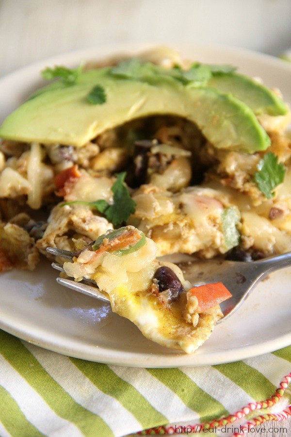 Southwestern Breakfast Scramble with eggs, black beans, peppers, cheese, and topped with avocado!