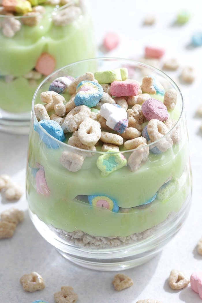 Lucky Charms Parfaits in a clear glass with green pudding and cereal on top
