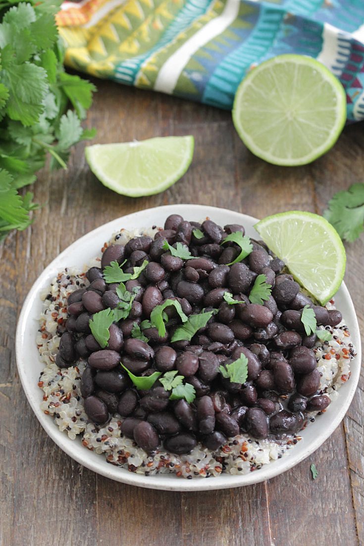 Instant Pot Black Beans on top of quinoa with fresh limes
