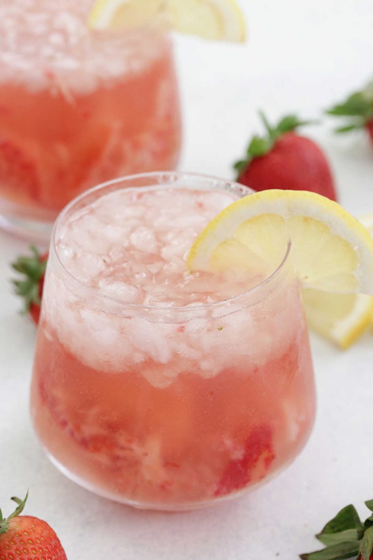 Strawberry Lemon Rosé in glasses with lemon slices and strawberries