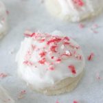 Peppermint Meltaways on a white board with crushed candy canes