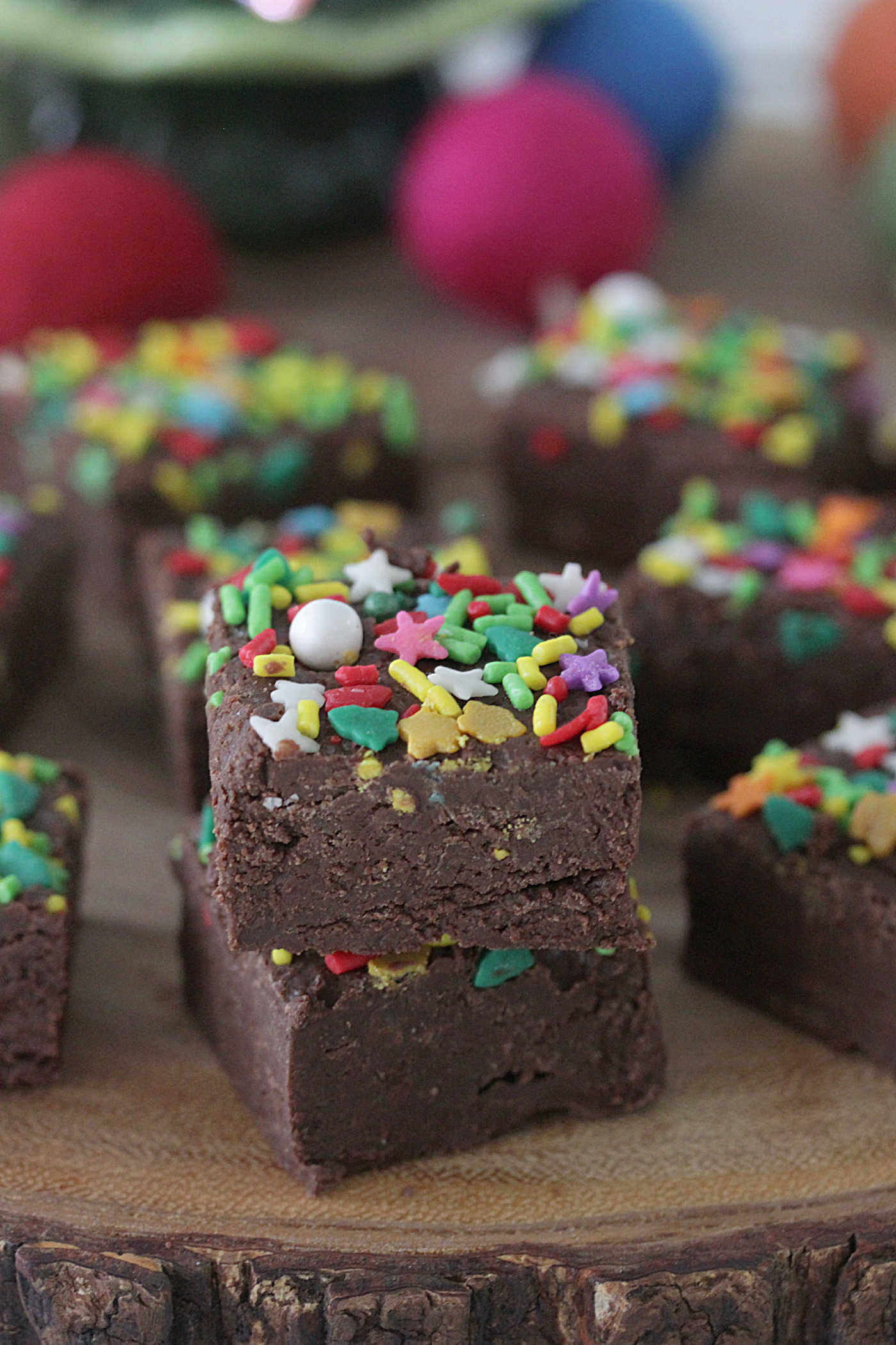 Three-Ingredient Holiday Fudge squares with holiday sprinkles