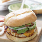 Cheddar Ranch Chicken Burger with lettuce, tomatoes, and onions
