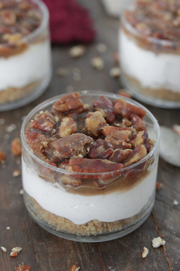 No-Bake Pecan Pie Cheesecakes in a glass bowl with crumbled pecans