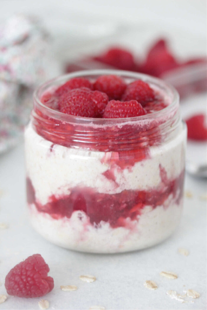 Raspberry Cheesecake Overnight Oats topped with fresh raspberries