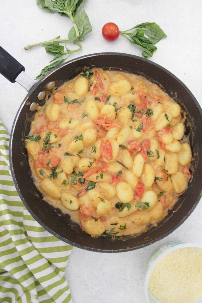 Overhead photo of Gnocchi with Creamy Tomato Basil Sauce in a skillet