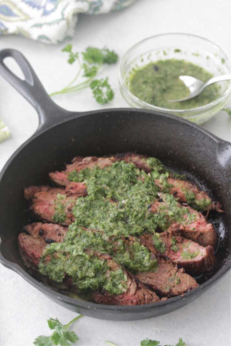 Flank Steak with Chimichurri in a cast iron pan